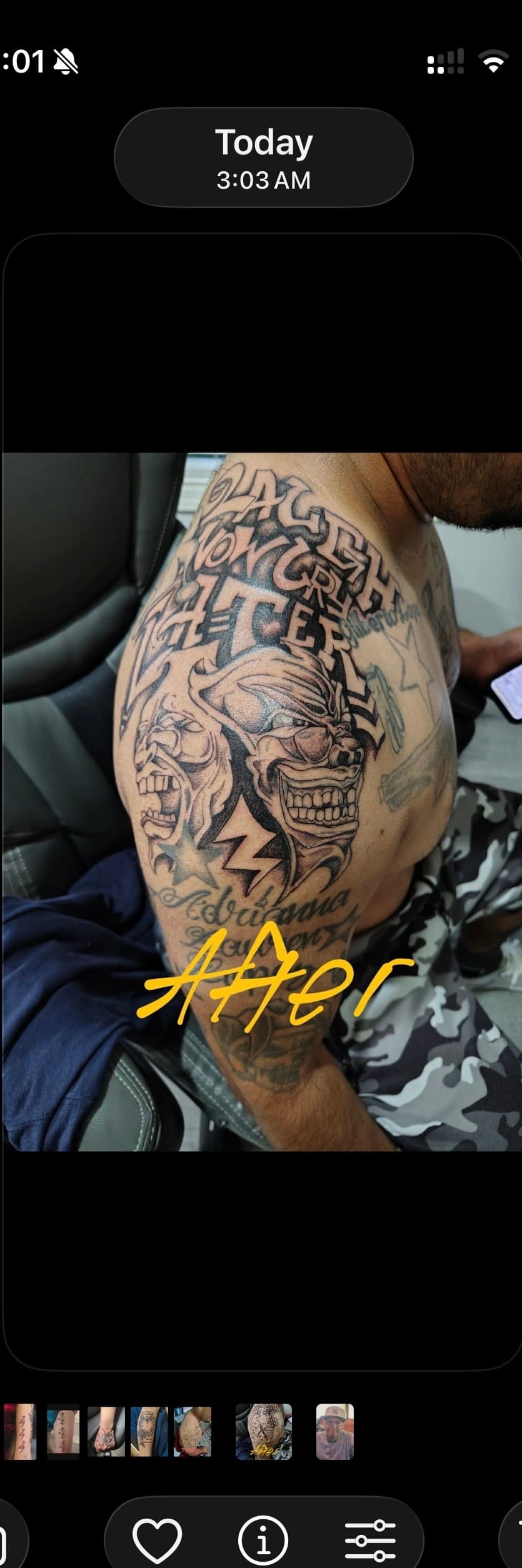 Man's shoulder tattoo featuring 'Laugh Now Cry Later' text and stylized comedy and tragedy masks.